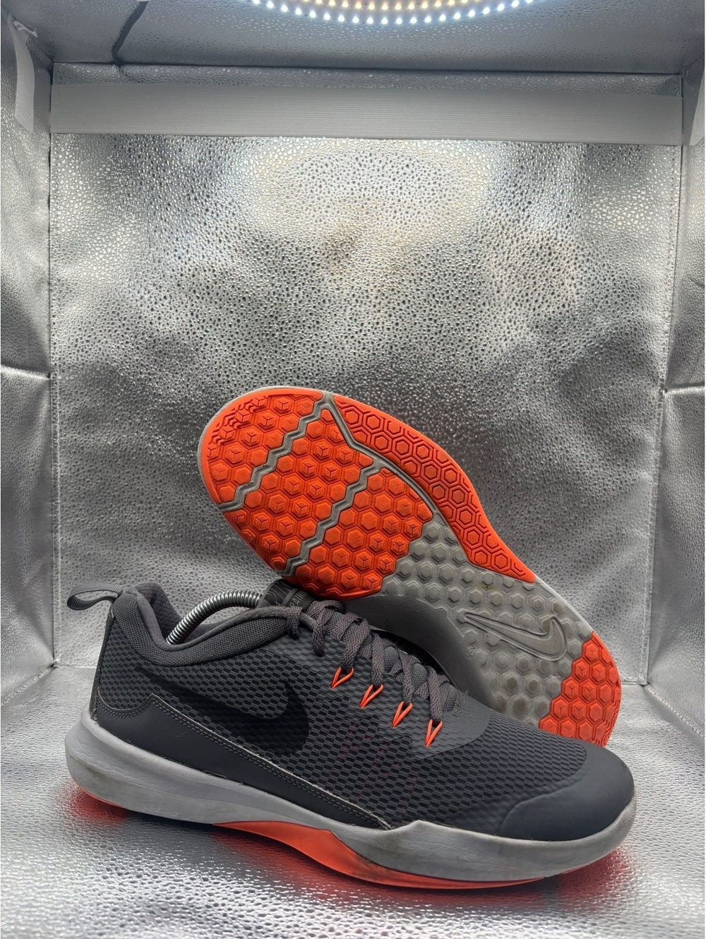 Nike legend trainer orange accents